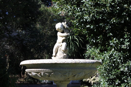 Old fountain with child sculpture 