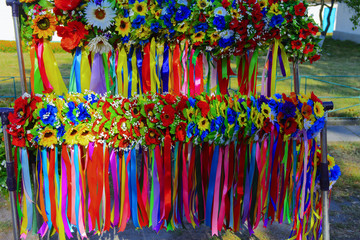 Fototapeta premium Exhibition - sale of women's wreaths and colored ribbons
