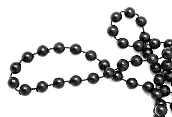 Black beads on a white background