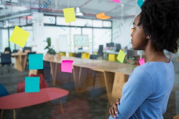 Female graphic designer looking at the glass