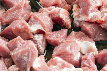Row meat chops in cast iron skillet
