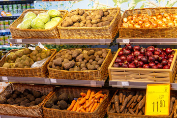 Shopping showcase in the supermarket with vegetables and fruit.