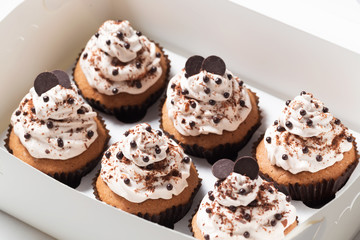 Delivery box with coffee cupcakes decorated mocha buttercream and chocolate chips 