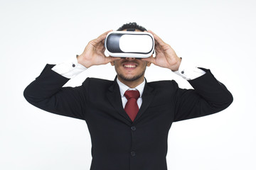 Business with glasses of virtual reality on white isolated background. Young guy in VR headset is looking at interactive screen. Playing mobile game app on device.