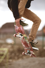 Close-up of skateboarders foot while skating in skate park © yanik88