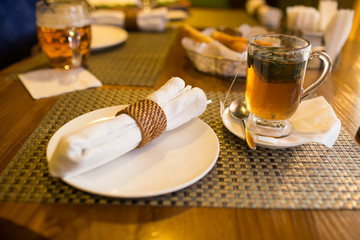 A plate and a cup of tea in a restaurant