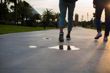 woman walking on the park at sunset.