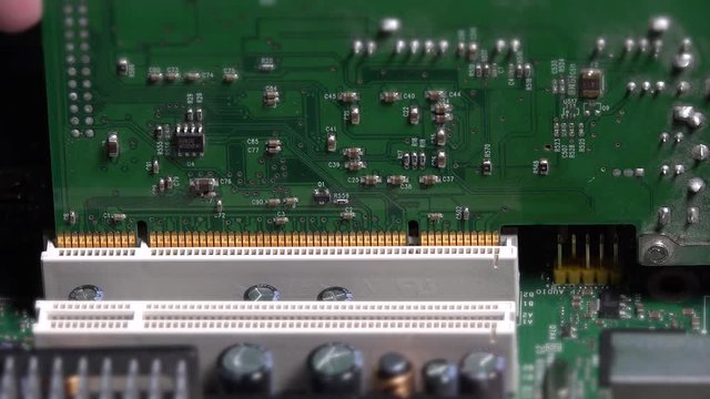 Hand insert pci card into motherboard slot on desktop computer