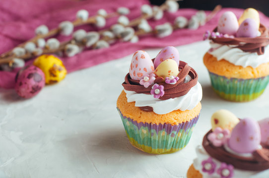 Easter cupcakes decorated with candy eggs in nest