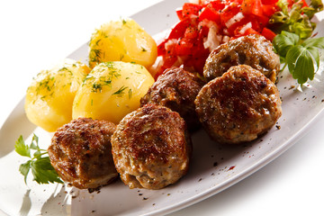 Roast meatballs with potatoes