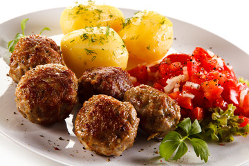 Roast meatballs with potatoes