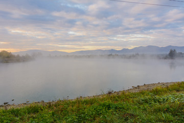 Lake in the mountains for recreation and fishing. Early morning