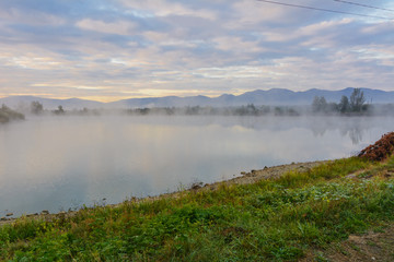 Lake in the mountains for recreation and fishing. Early morning