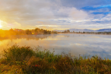 Naklejka na ściany i meble Lake in the mountains for recreation and fishing. Early morning