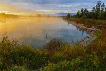 Lake in the mountains for recreation and fishing. Early morning