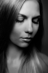 Fototapeta premium Black and white studio portrait of a cute girl