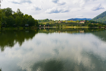 Fototapeta na wymiar Lake in the mountains for recreation and fishing