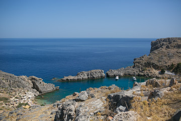 Fototapeta na wymiar RHODES, GREECE: Bay and rocks