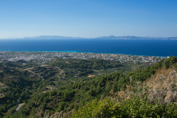 Fototapeta na wymiar LINDOS, RHODES, GREECE: Aerial view of landscape and over town