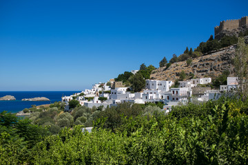 Naklejka na ściany i meble LINDOS, RHODES, GREECE: Famous white houses on a rock
