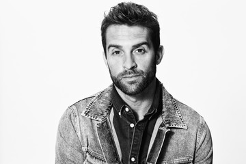 Denim jacket man looking at camera