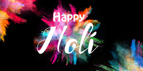 Colored powder explosion on black background.