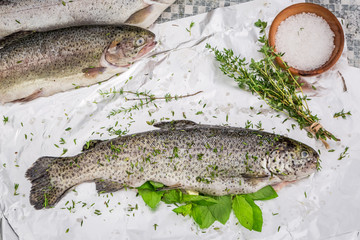 Preparing whole trout for grill in the garden