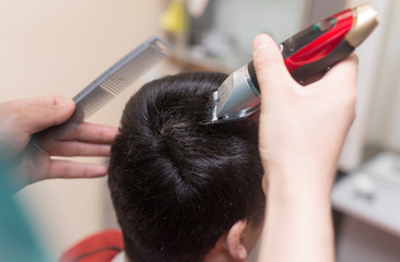 Man's haircut trimmer in the beauty salon