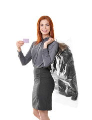 Happy woman holding coat in plastic carrying case on white background