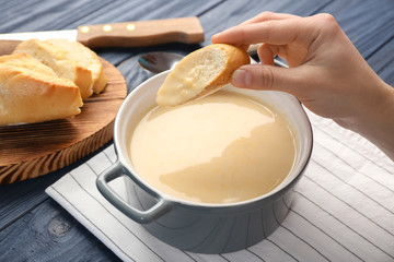 Woman eating delicious cream soup