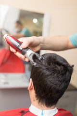 Man's haircut trimmer in the beauty salon