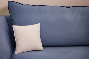 Blank soft pillow on cozy couch