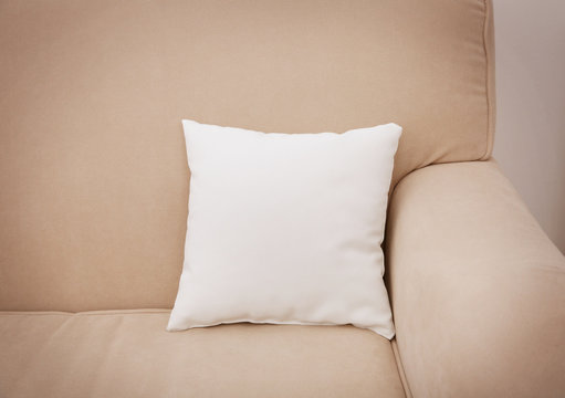 Blank Soft Pillow On Cozy Couch