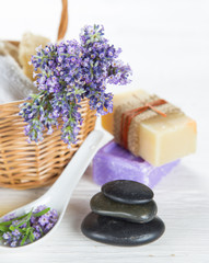 Wellness treatments with lavender flowers on wooden table.