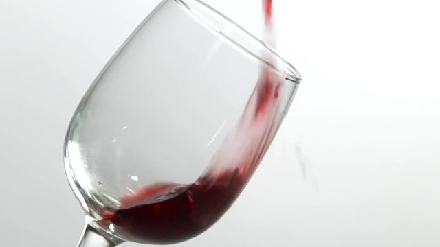 Red wine poured into glass shooting with high speed camera, phantom flex.
