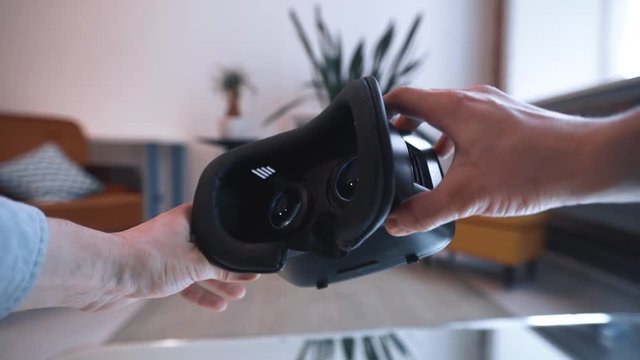 Putting on VR glasses Virtual Reality point of view taking of VR glasses