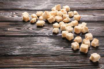 Bread pieces on wooden background