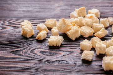 Bread pieces on wooden background