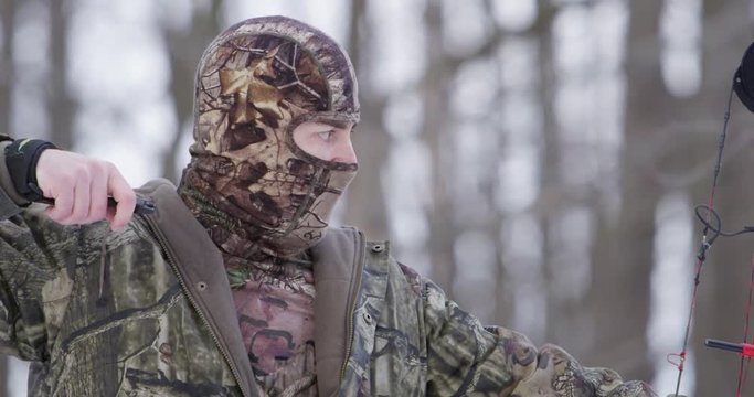 bow hunter close up draw and release arrow 4k