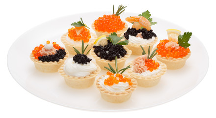 Set tartlets on a white plate.