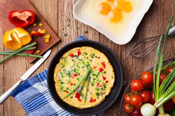Foto auf Acrylglas Spiegeleier Delicious omelette with vegetables
