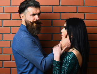 bearded man and pretty sexy woman with cigar