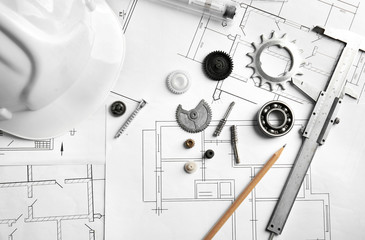 Different kinds of engineering tools on construction drawings background
