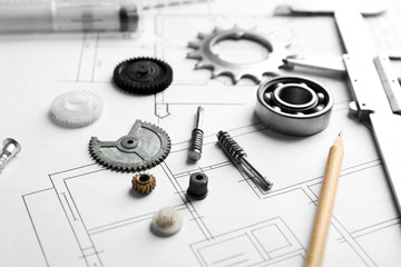 Different kinds of engineering tools on construction drawings background