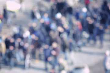 Obraz premium Crowd of people walking on busy city street, blurred view