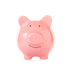 Pink ceramic piggy bank on white background