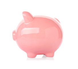 Pink ceramic piggy bank on white background