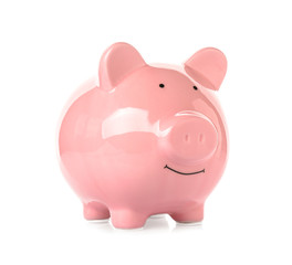 Pink ceramic piggy bank on white background