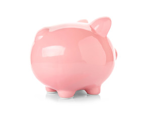 Pink ceramic piggy bank on white background