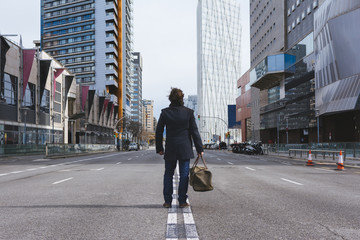 Young man standing alone in the street © carlesmayet